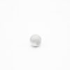 This is a bead, made from plastic and White in colour.