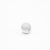 This is a bead, made from plastic and White in colour.