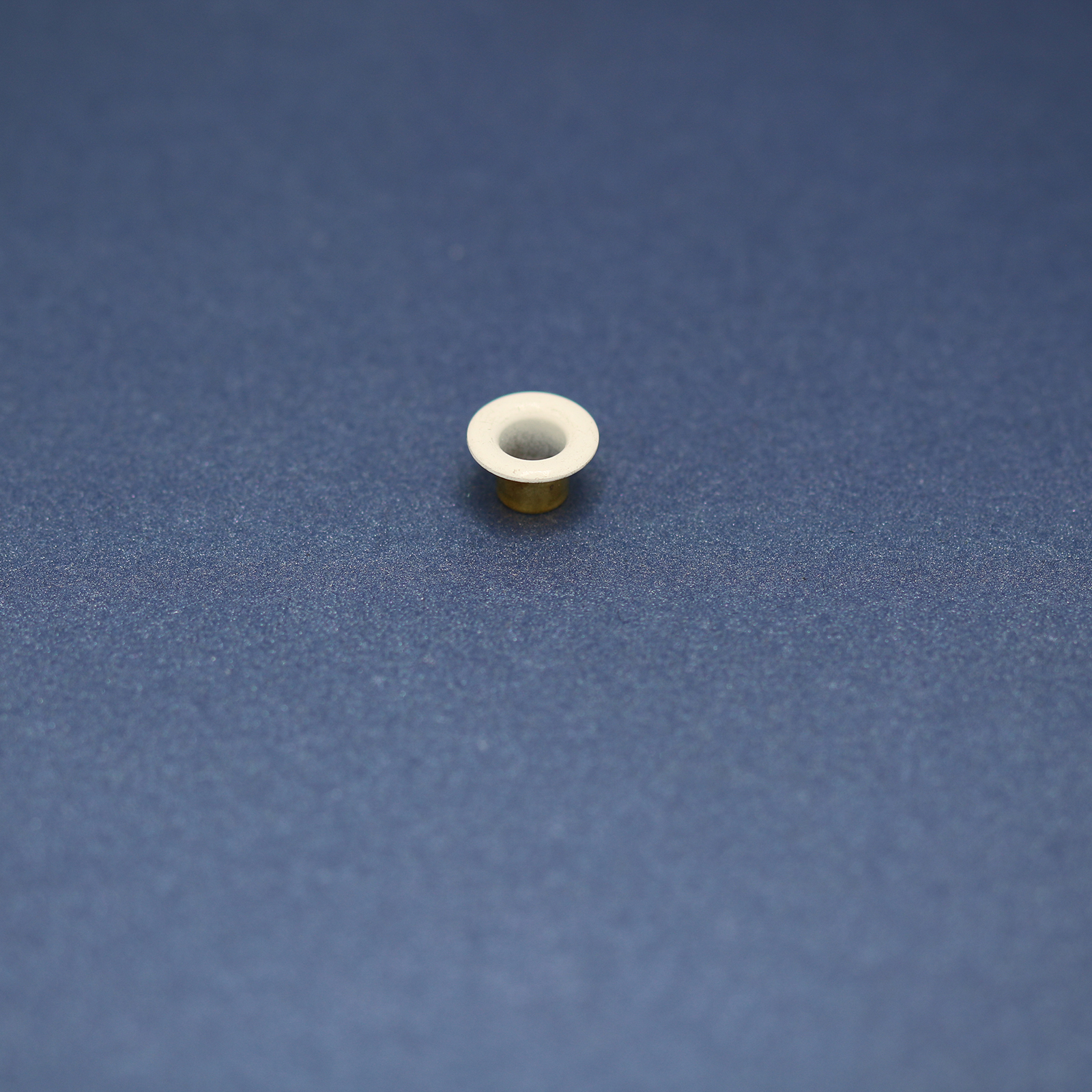 This is a 10mm eyelet, made from brass and White in colour.