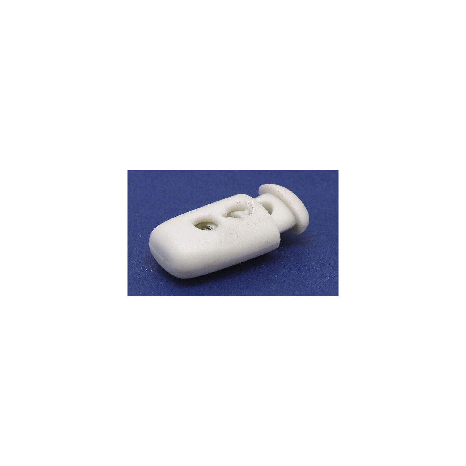 This is a toggle, made from plastic and White in colour.