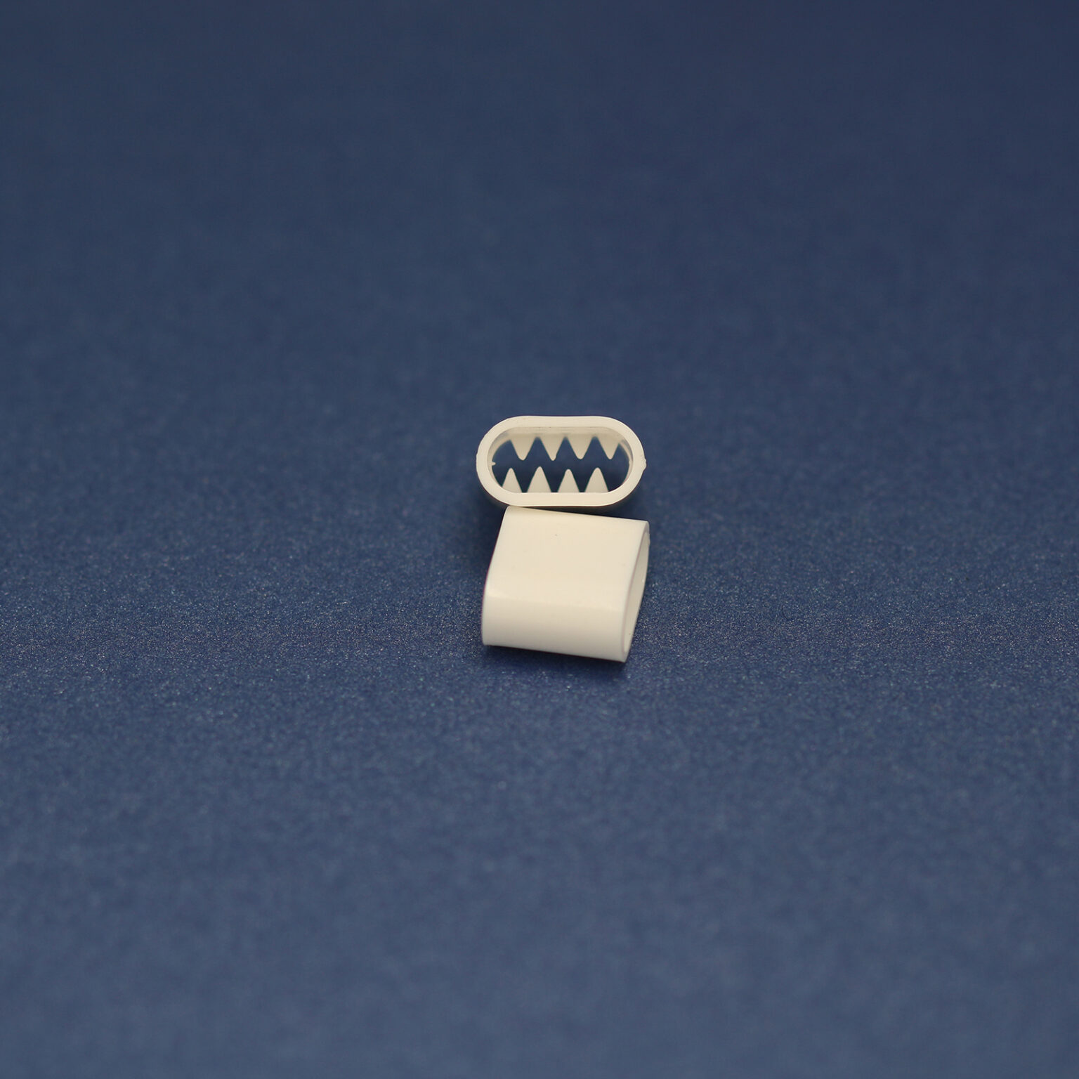 This is a 11mm toggle, made from plastic and White in colour.