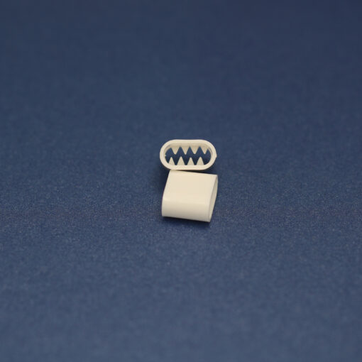 This is a 11mm toggle, made from plastic and White in colour.