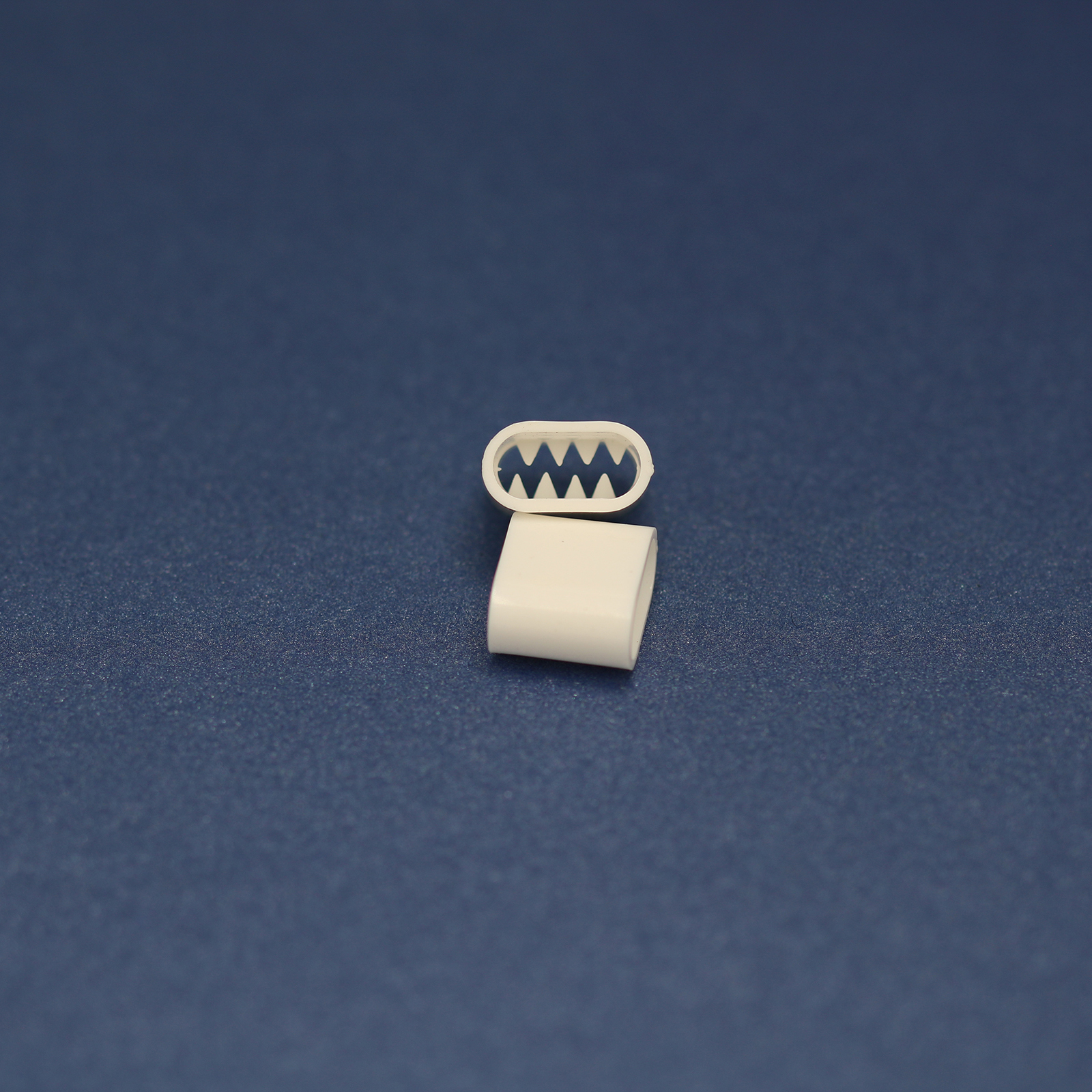 This is a 11mm toggle, made from plastic and White in colour.
