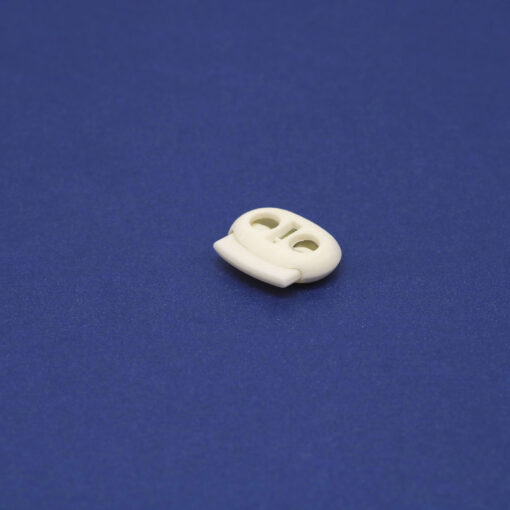 This is a 23mm toggle, made from plastic and White in colour.