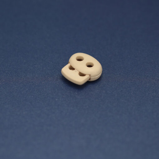 This is a 17mm toggle, made from plastic and Stone in colour.