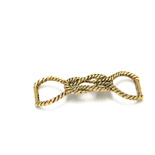 This is a trim, made from plastic and Brass in colour.