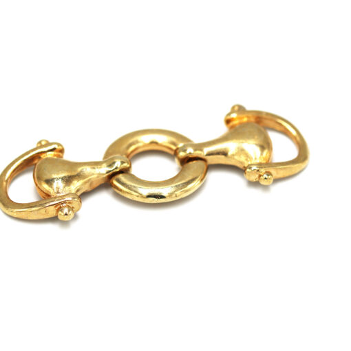 This is a trim, made from cast and Gold in colour.
