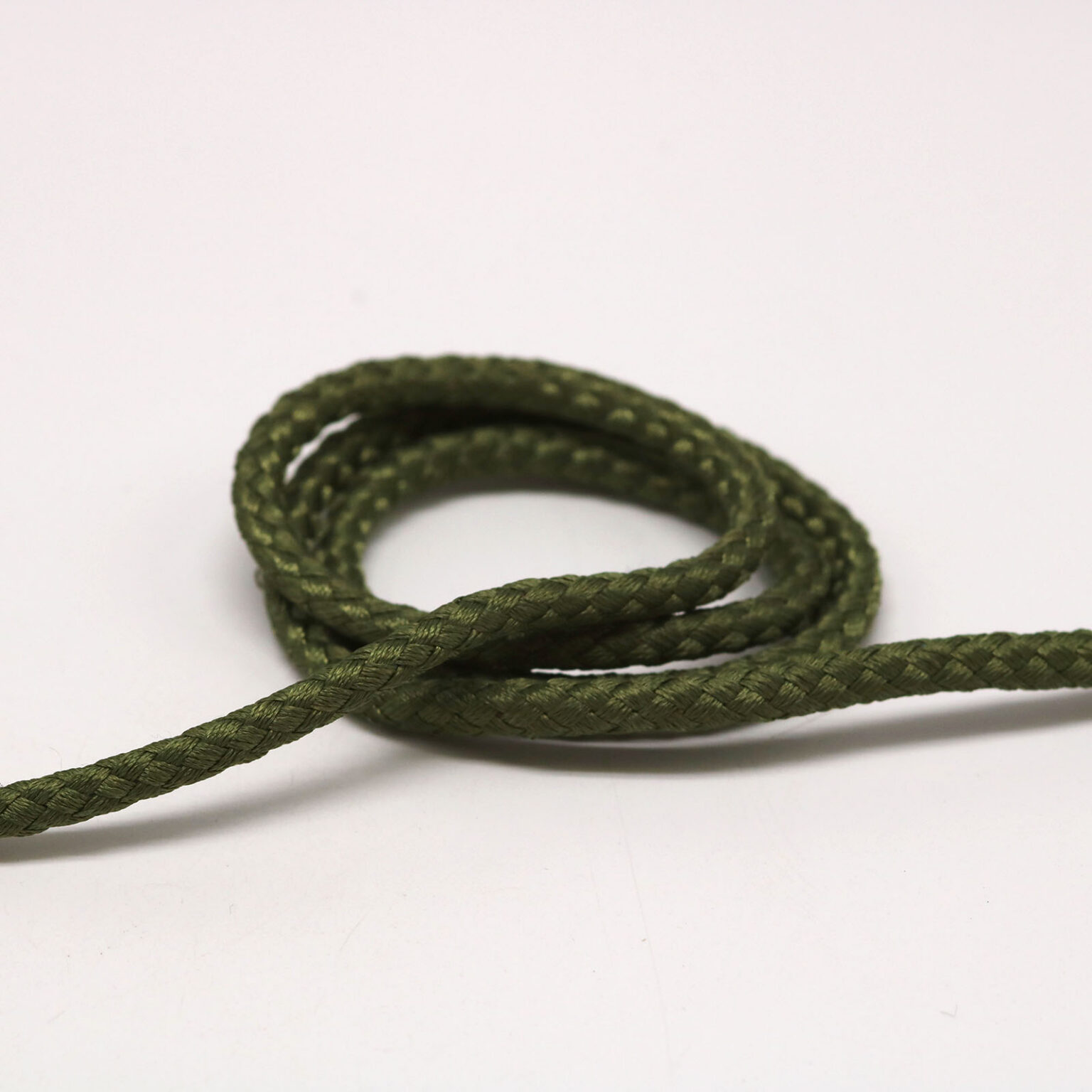 This is a 4mm drawcord, made from cast zinc and Olive in colour.