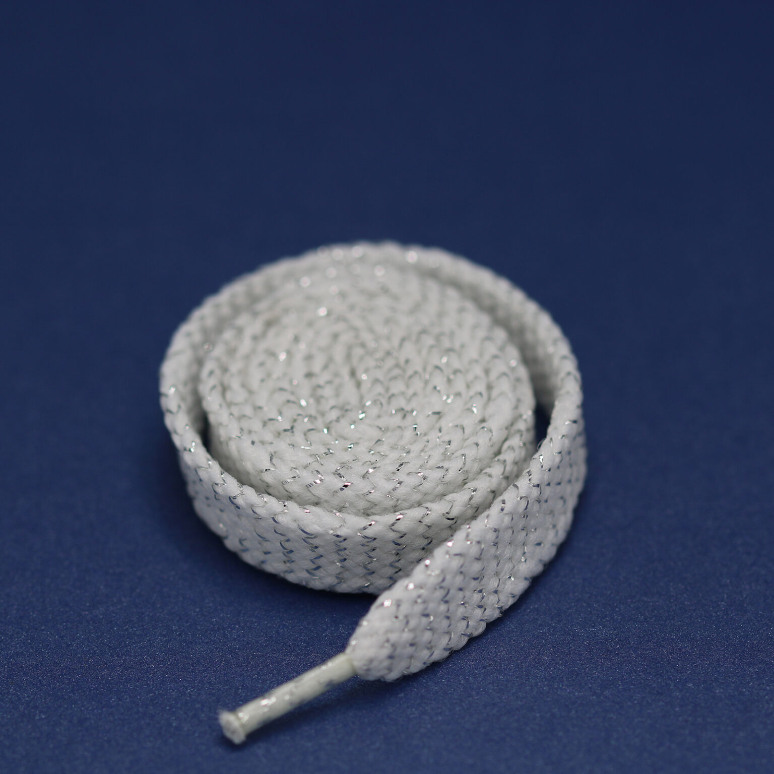 This is a 65mm drawcord and White in colour.
