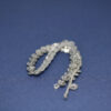 This is a drawcord, made from plastic and Silver in colour.